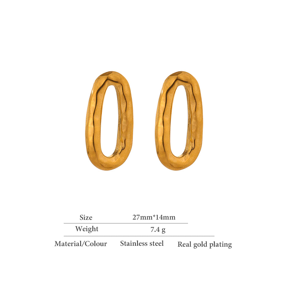 Delicate gold hoop earring photographed against soft studio light - Let's Jam, Camden Town