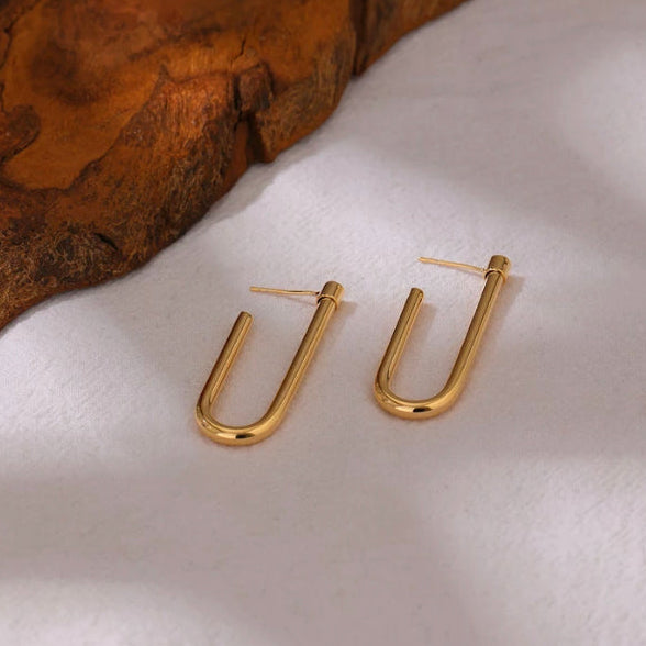 Gold-plated U-shaped drop earrings with an open back, shown as a pair - Let's Jam, Camden Town