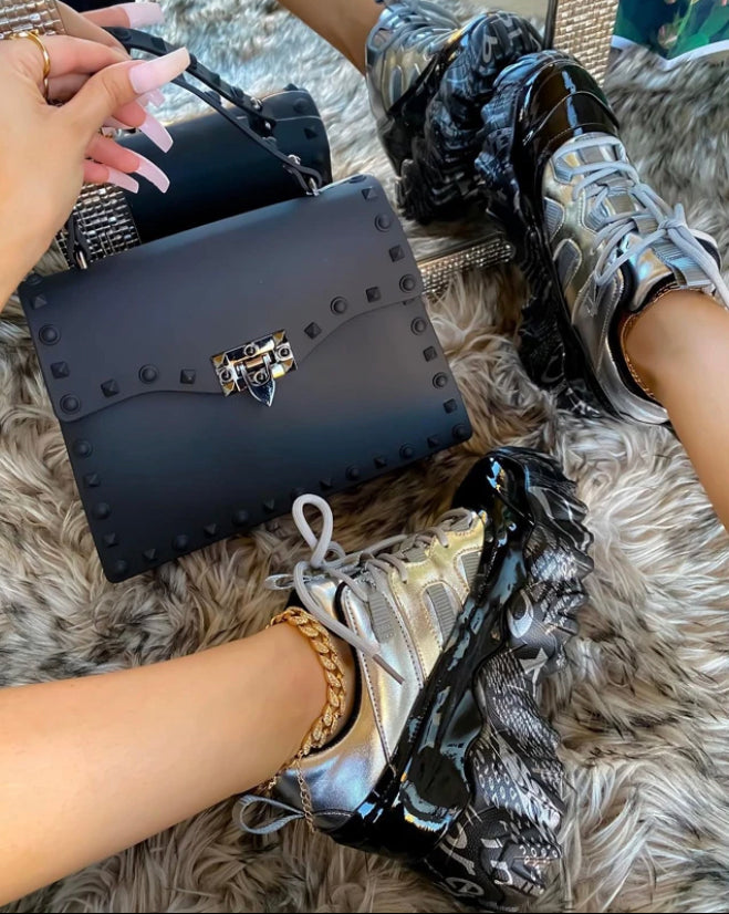 Silver grey PVC bag with a short top handle and clasp - Let's Jam accessories, Camden Market London