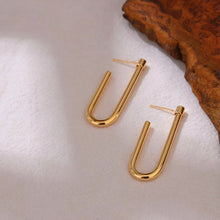 Load image into Gallery viewer, Side view of a polished gold U earring showing its smooth curved profile - Let's Jam jewellery, Camden Market London
