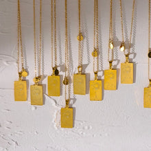 Load image into Gallery viewer, Close-up of the small dangling zodiac charm attached beside the main pendant - Let's Jam jewellery, Camden Market London