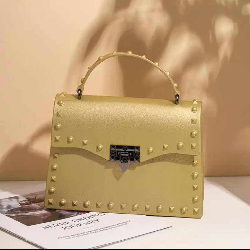 Champagne coloured handbag with gold-tone hardware and a short handle - Let's Jam, Camden Market, London