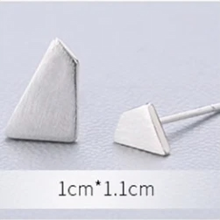 Load image into Gallery viewer, Angled view of a polished silver triangle stud earring - Let's Jam jewellery, Camden Market London