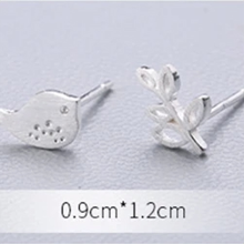 Load image into Gallery viewer, Bird and twig stud earrings photographed from above - Let's Jam, Camden Market, London