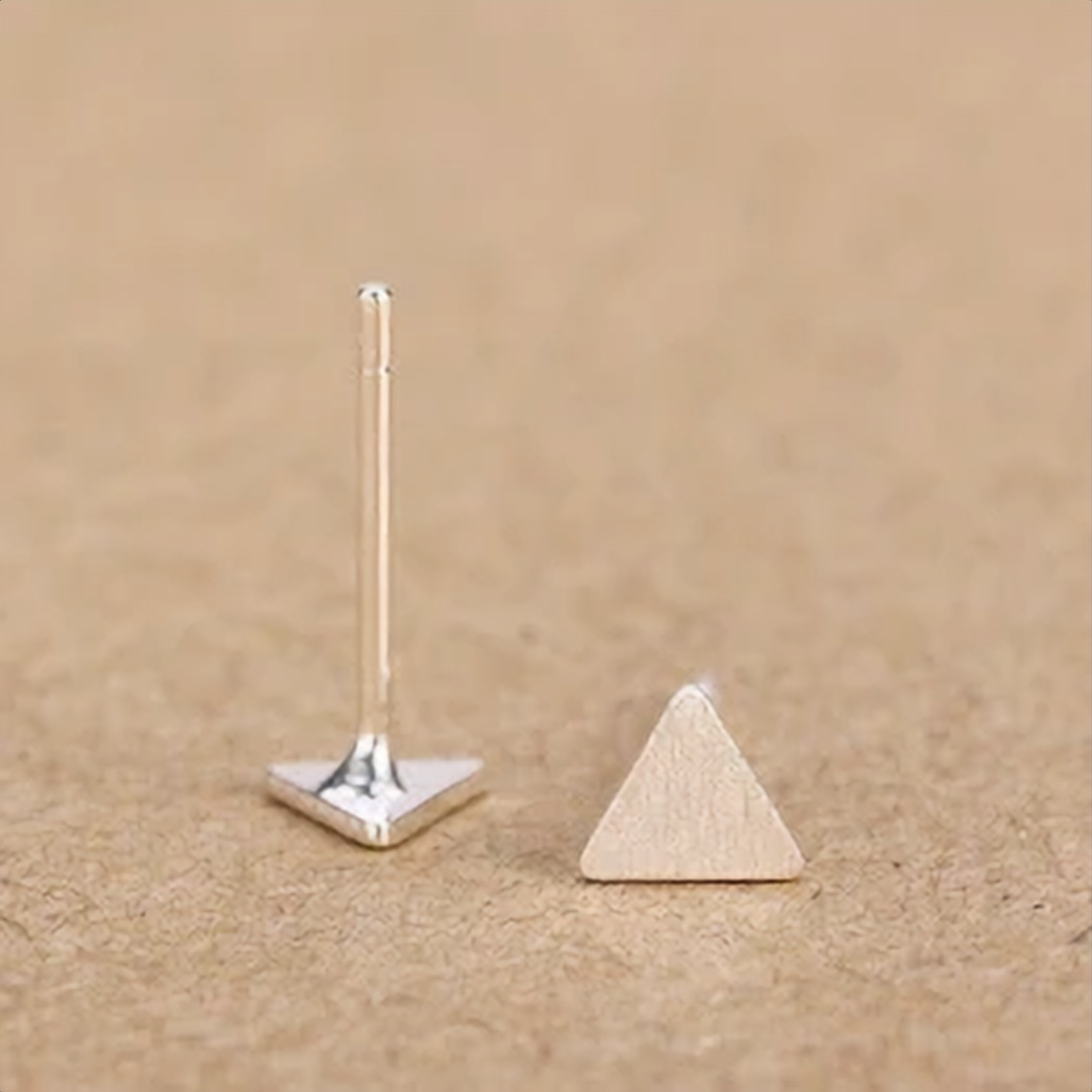 Two silver triangle studs resting side by side - Let's Jam, Camden Town