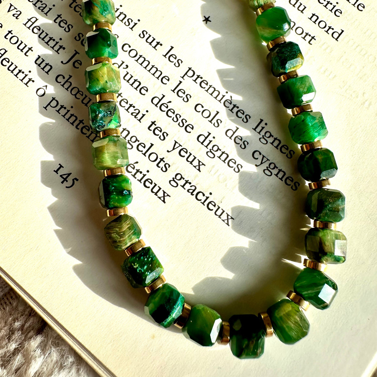 Close-up of the green tiger's eye beads showing their banded sheen - Let's Jam jewellery, Camden Market