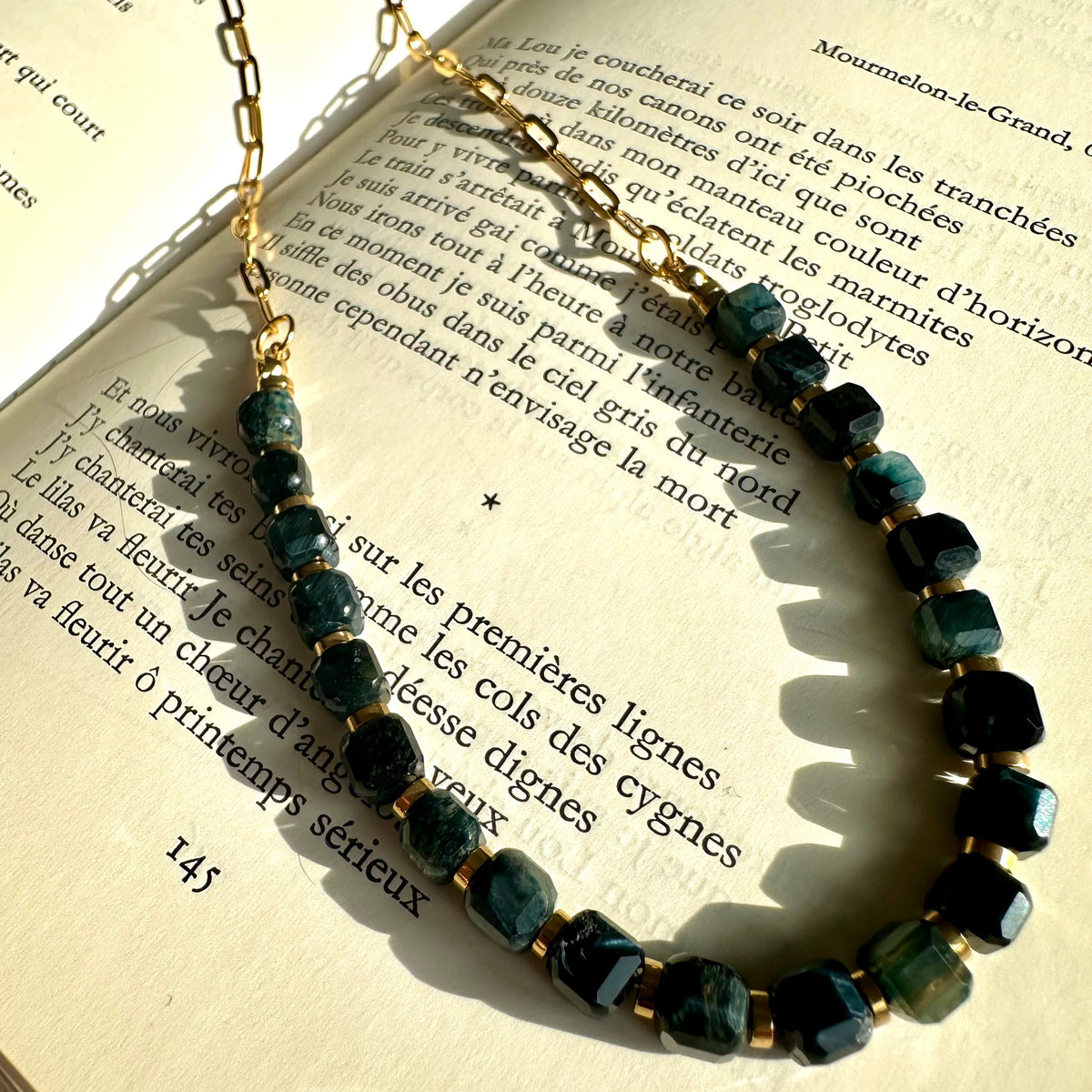Close-up of the polished black tiger's eye beads with their silky sheen - Let's Jam jewellery, Camden Market