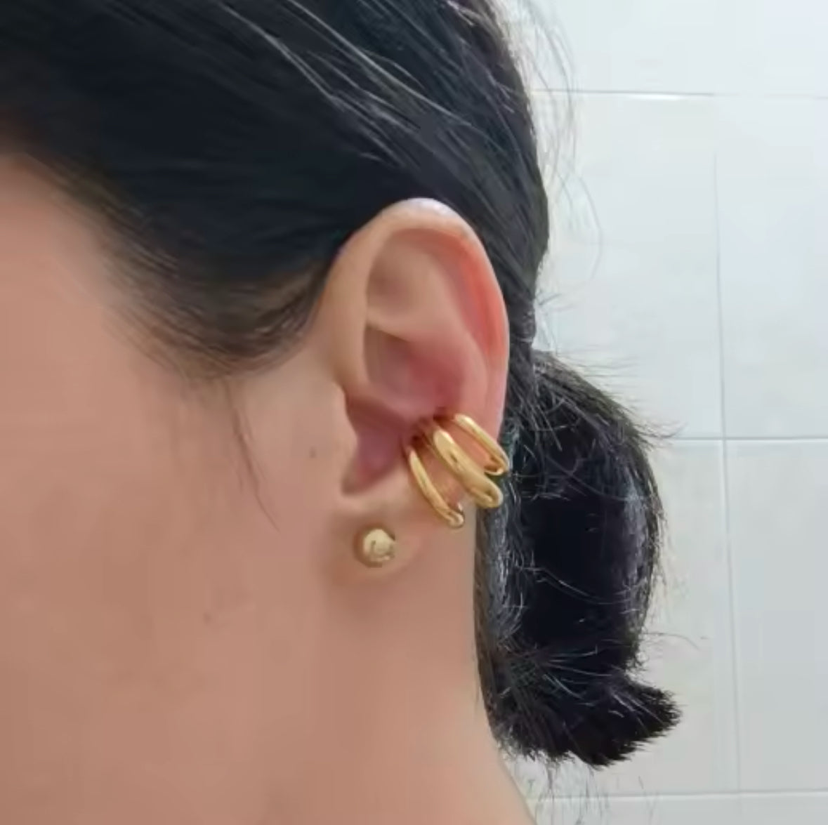 Close-up of the triple-loop cuff clipped onto the outer ear - Let's Jam jewellery, Camden Market London