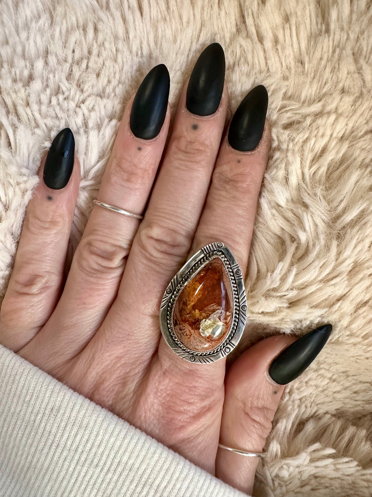 Handmade 925 sterling silver ring with a teardrop Mexican fire opal in warm orange-amber tones, decorative rope-edge silver bezel, one-of-a-kind gemstone ring - Let's Jam jewellery collection