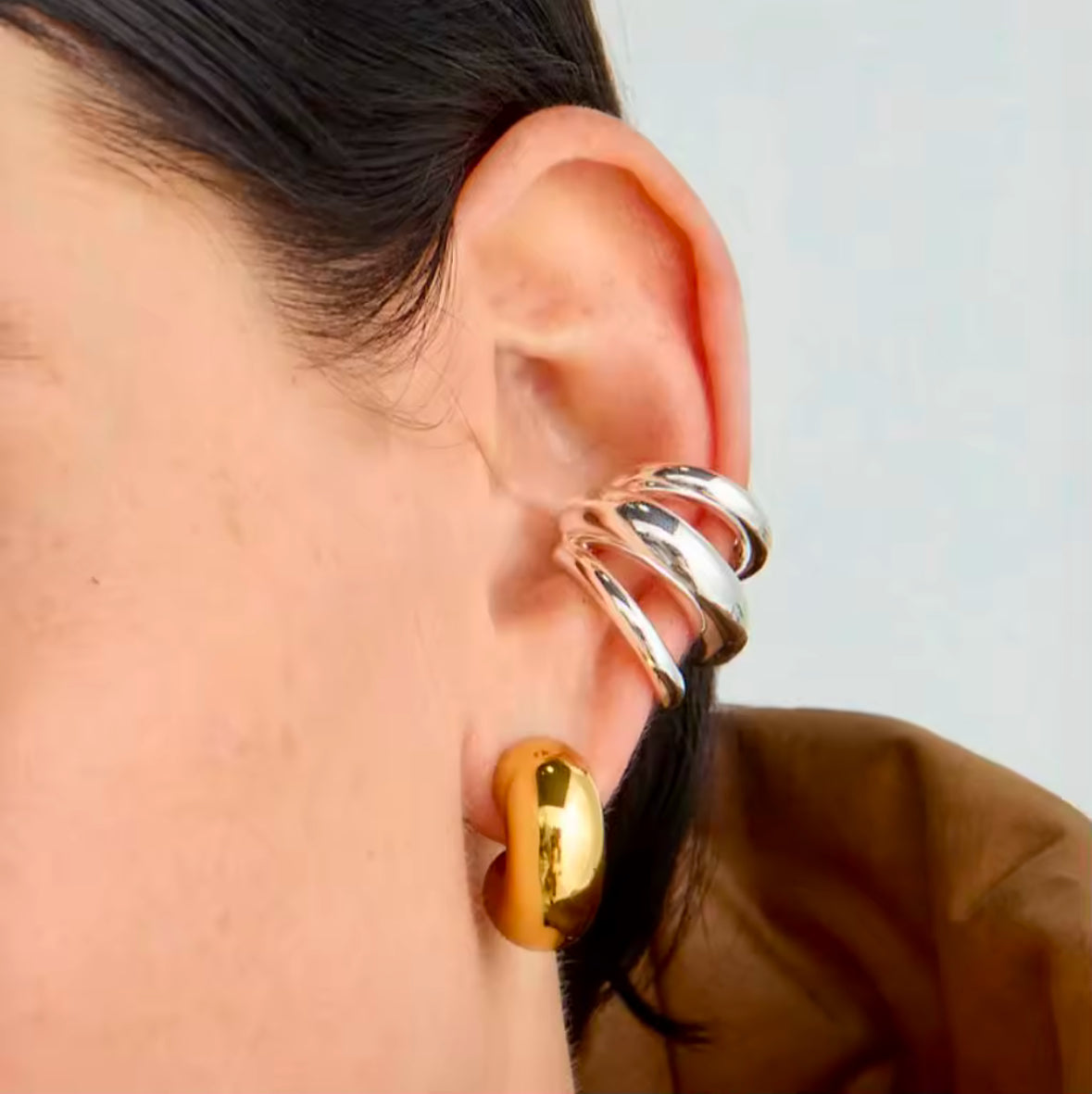 Silver three-layer ear cuff worn without a piercing - Let's Jam, Camden Market, London