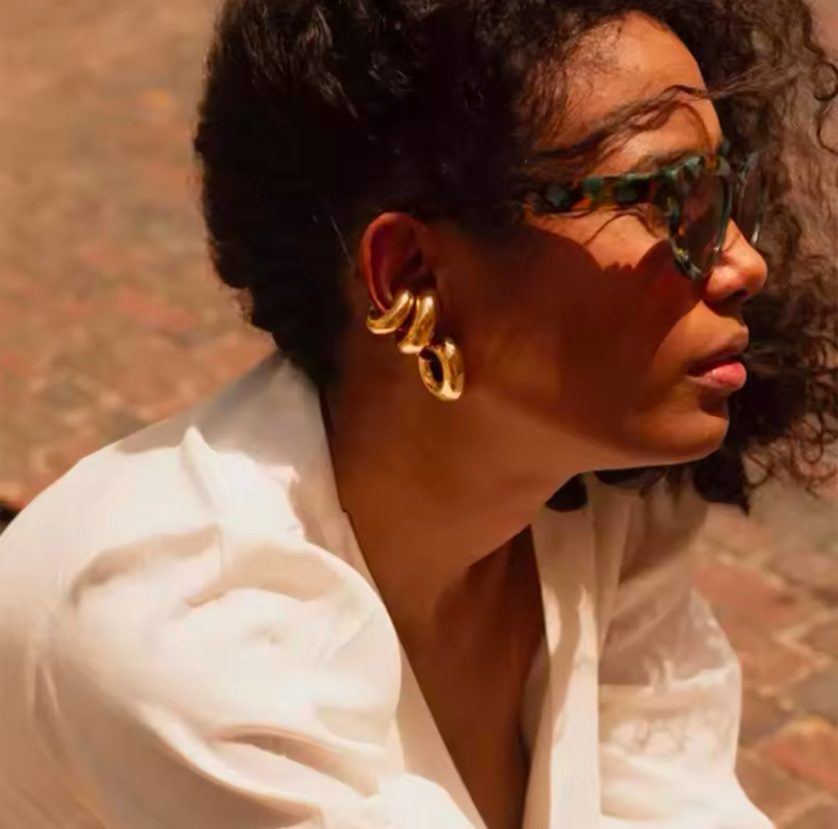 Gold stainless steel ear cuff and matching hoop earring worn together - Let's Jam, Camden Market