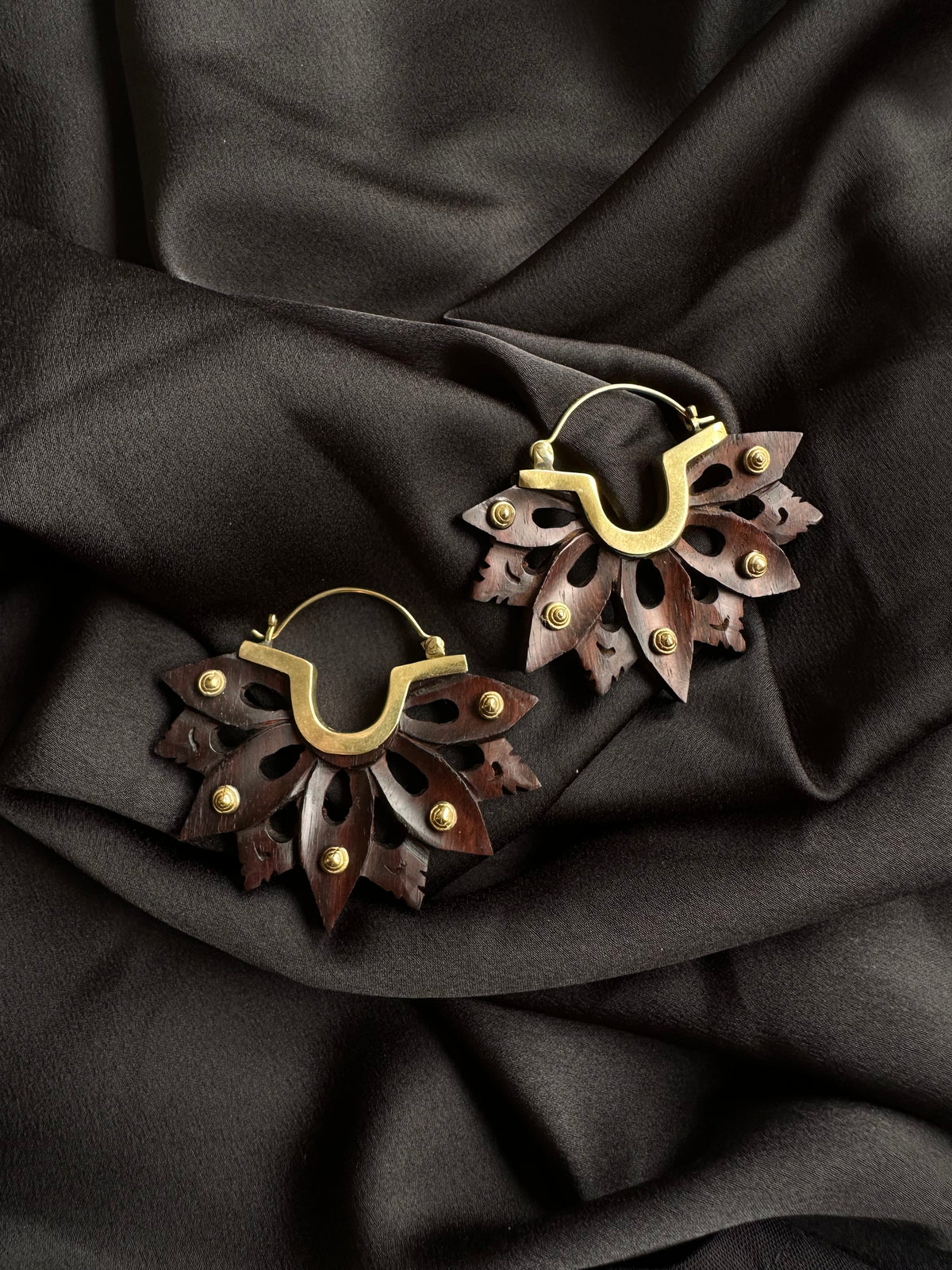 Single sculpted lotus earring held up to show its full drop - Let's Jam jewellery, Camden Town London