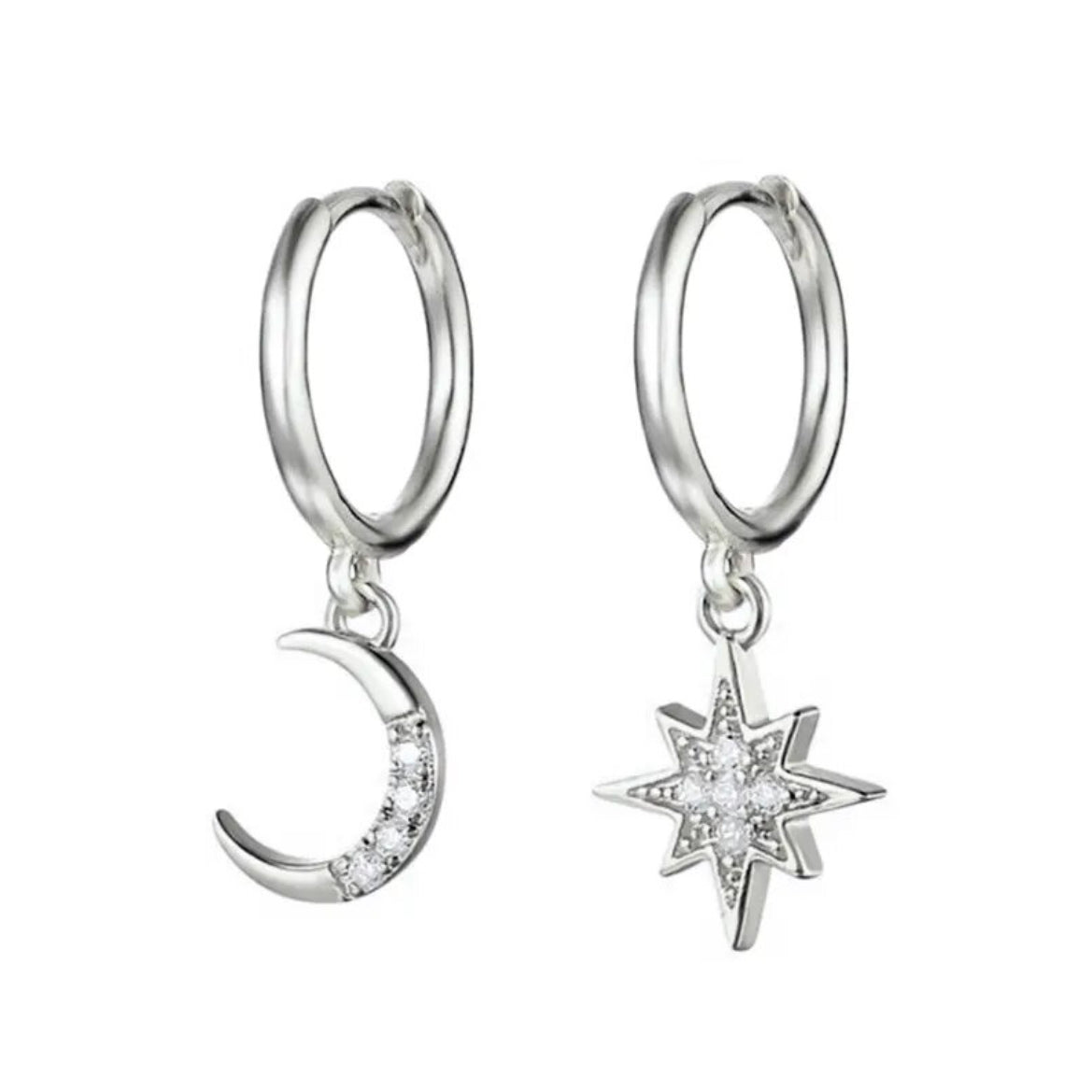 Pair of silver-plated hoop earrings with dangling charms, a crescent moon and an eight-point star, both set with zirconia stones, on a white background - Let's Jam jewellery collection