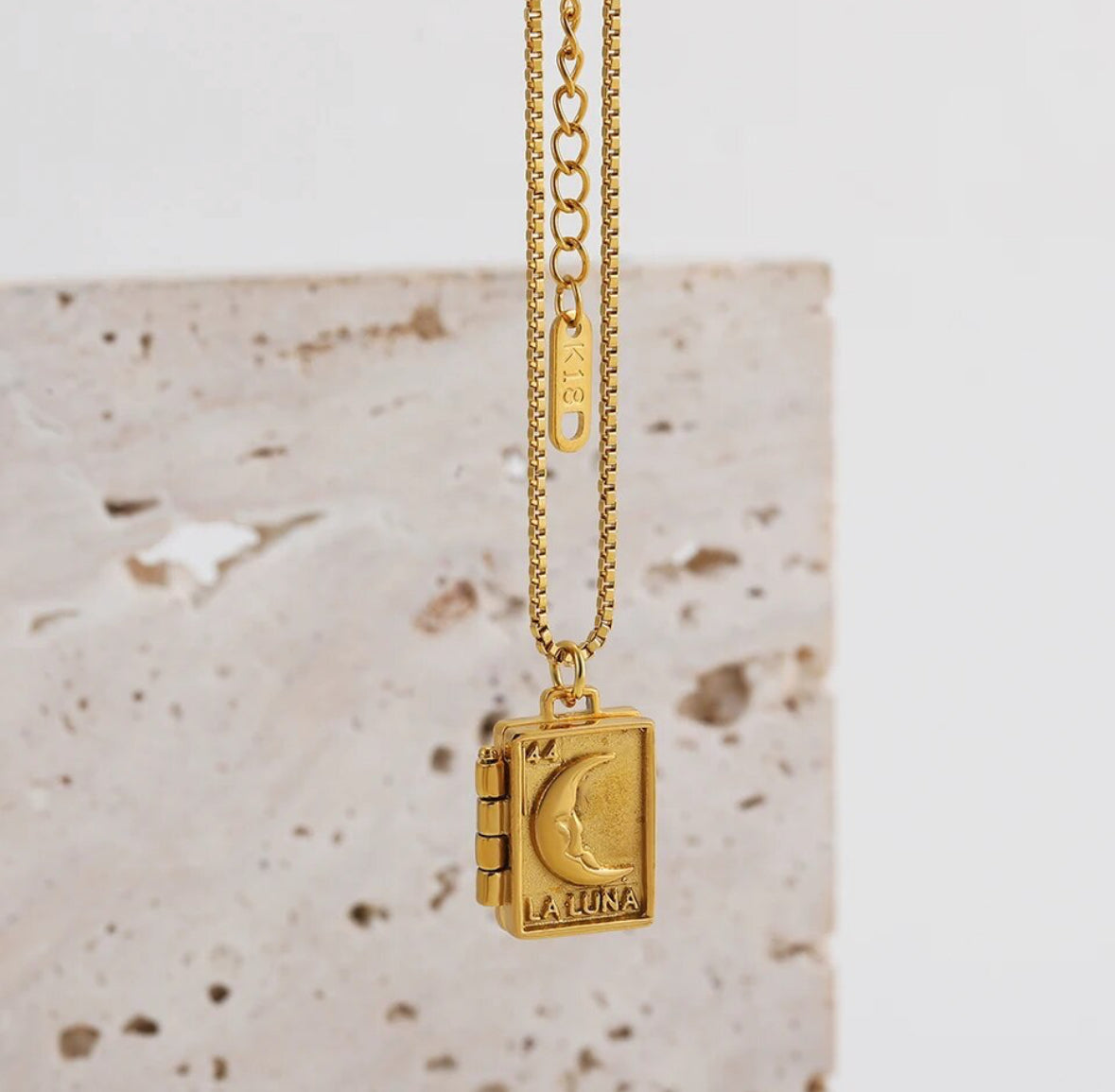 Heart locket photographed from above with the chain coiled around it - Let's Jam jewellery, Camden Town London