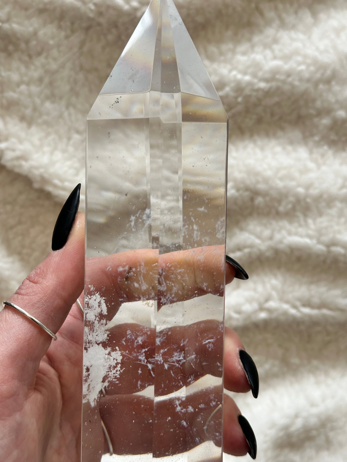 Clear quartz tower resting in the hand to show its size - Let's Jam, Camden Market London