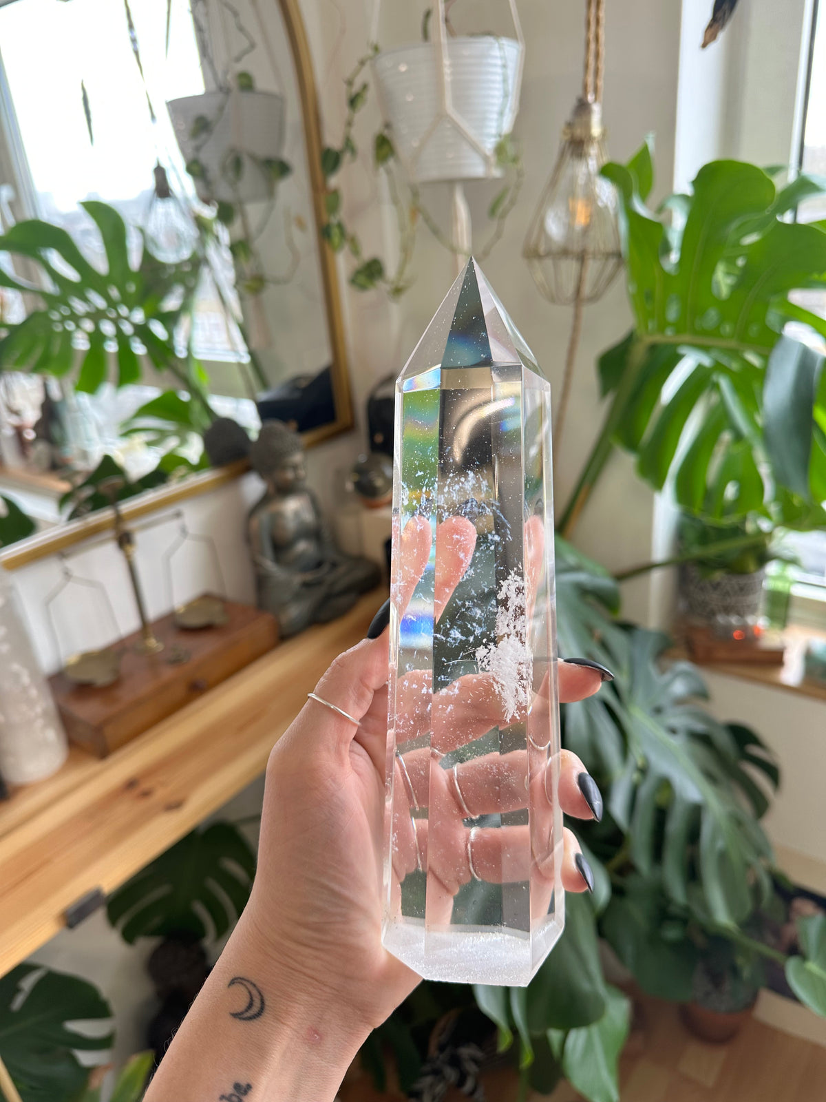 Clear quartz crystal tower with natural inclusions running through the point - Let's Jam crystal shop, Camden Market