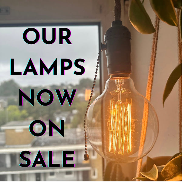 The Wanderer hemp cord pendant lamp with round Edison filament bulb, hanging by a window - Let's Jam collection