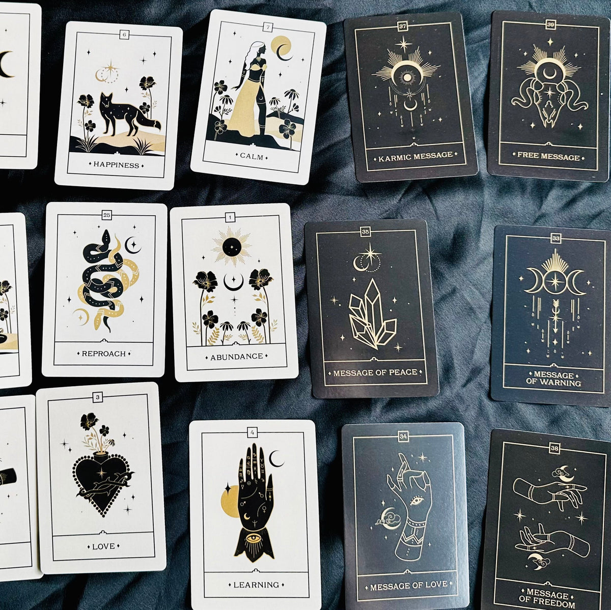 Voice of the Souls oracle cards fanned out in black and gold - Let's Jam tarot and oracle, Camden Market