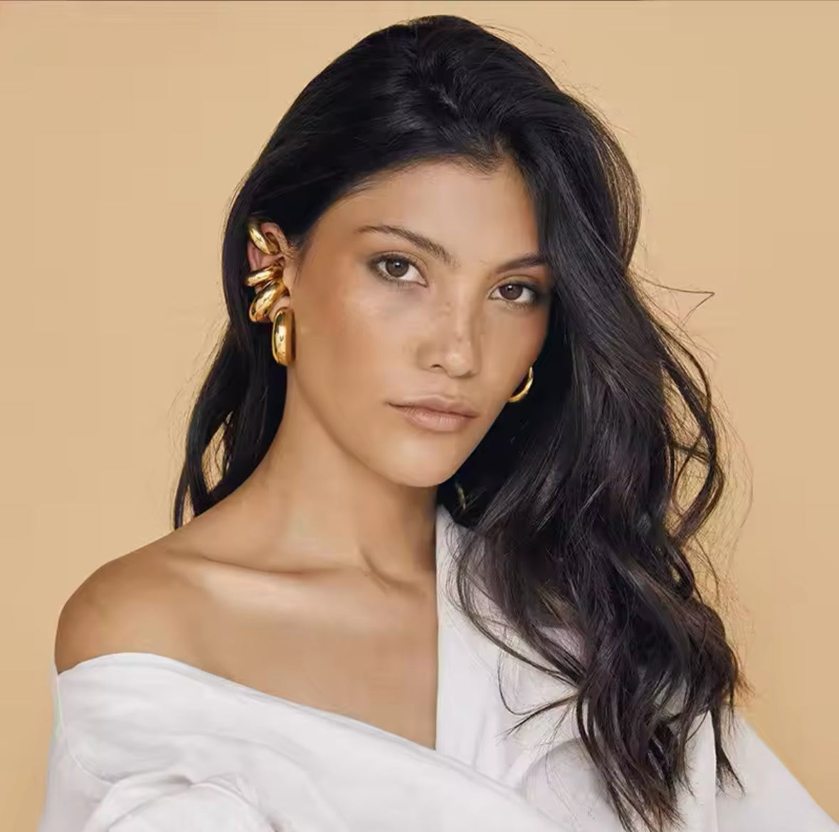 Model wearing matching gold-tone ear cuff and hoop earring set - Let's Jam jewellery collection