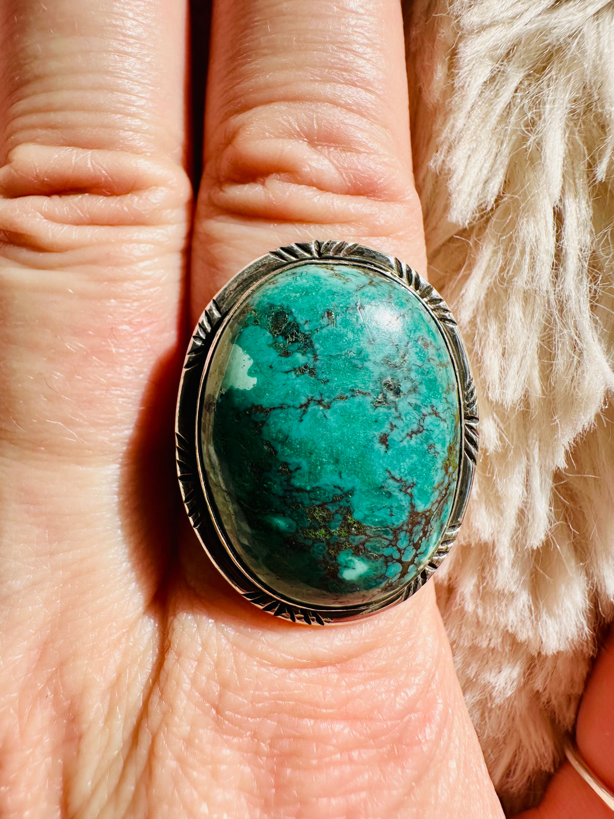 Large oval green-blue turquoise cabochon ring with dark matrix veining, set in a coin-edged sterling silver bezel - Let's Jam jewellery collection