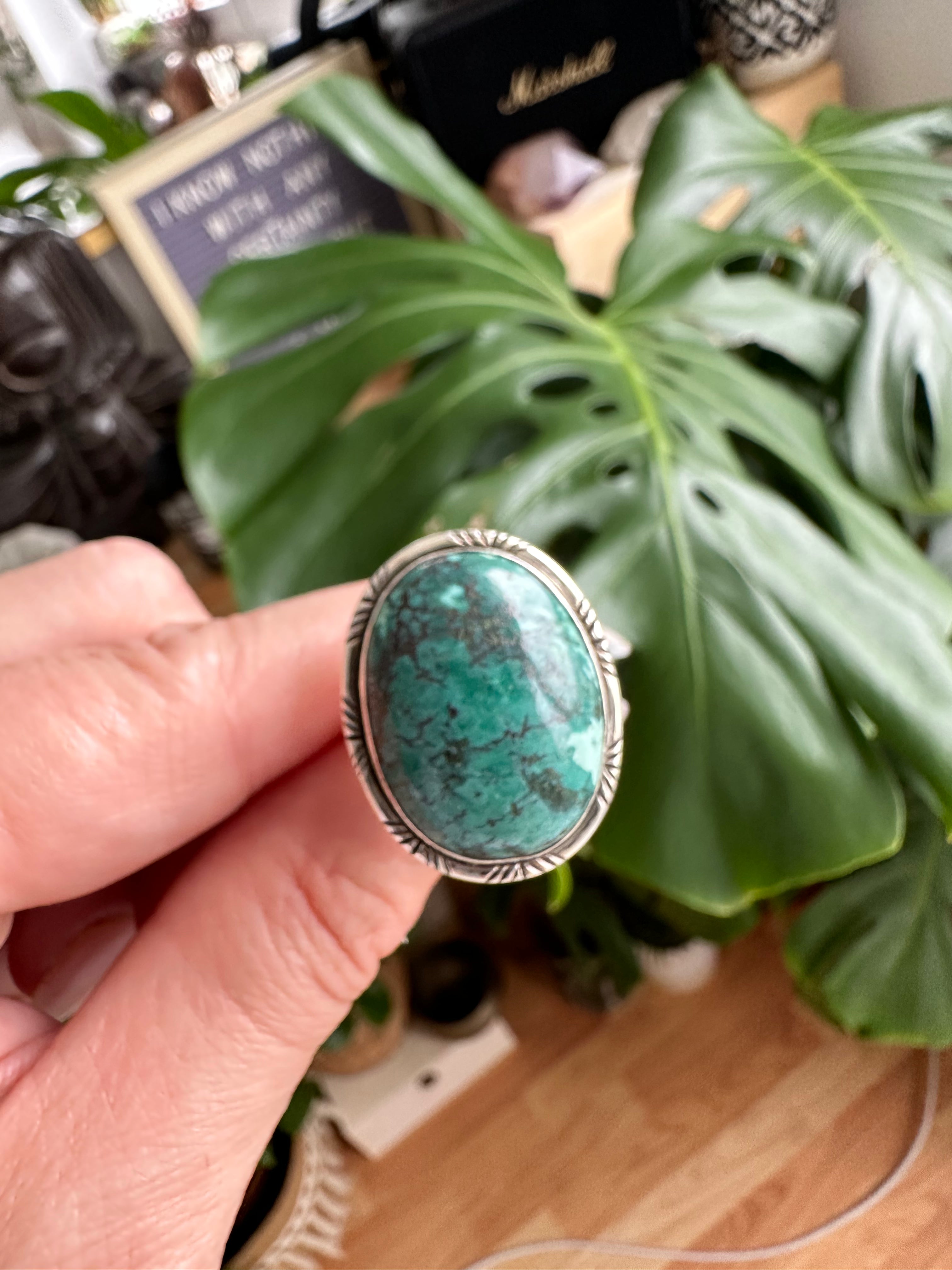 Sterling silver ring featuring an oval African turquoise cabochon in mottled green with a grey web-like matrix, set in a simple engraved silver bezel - Let's Jam jewellery collection