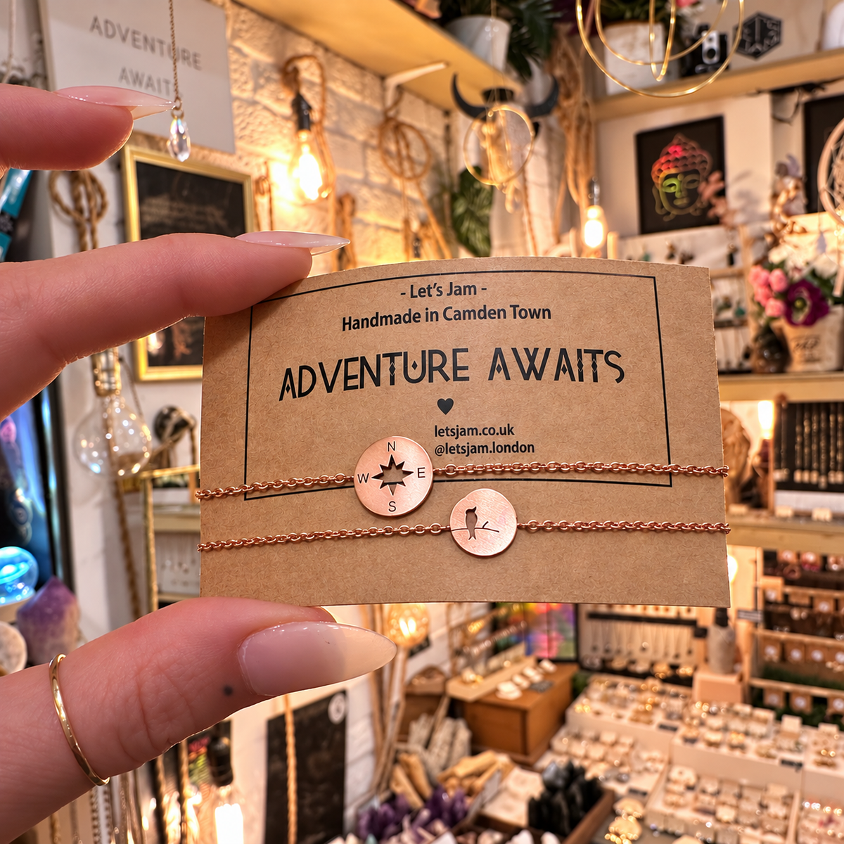 Bird and compass charm bracelets on an Adventure Awaits card - Let's Jam, Camden Market, London