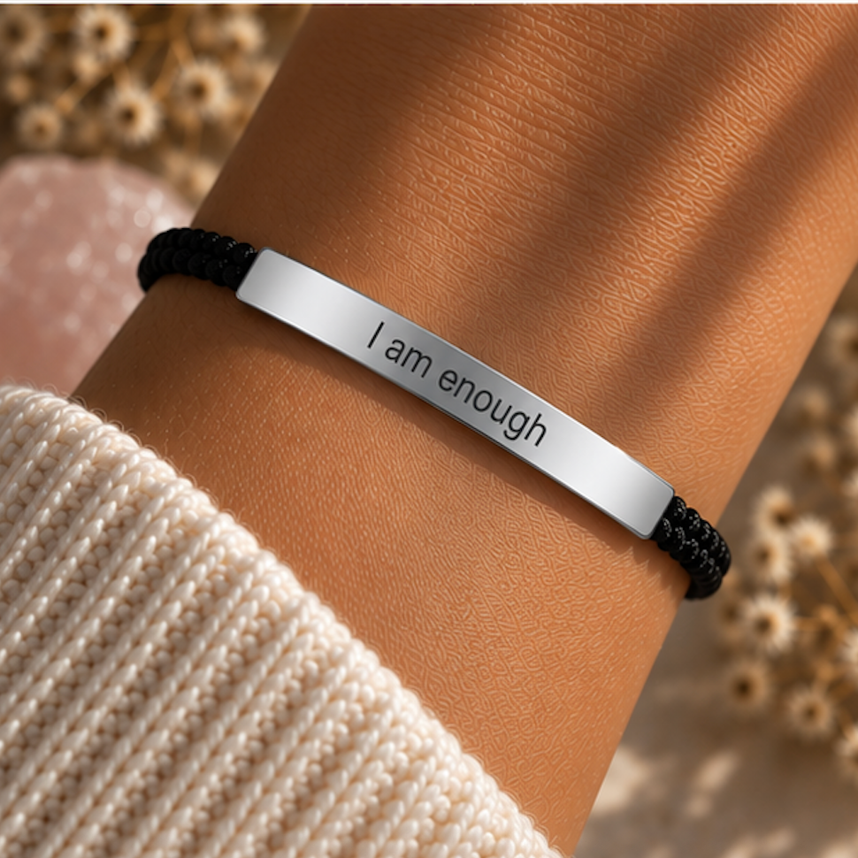 Black cord bracelet with a silver I Am Enough bar and a knit sleeve behind - Let's Jam, Camden Town