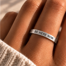 Load image into Gallery viewer, Hand wearing the silver 'Be here now' affirmation ring - Let's Jam jewellery, Camden Market
