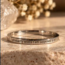 Load image into Gallery viewer, Silver affirmation ring engraved 'I am exactly where I am supposed to be' on a stone surface - Let's Jam, Camden Town London
