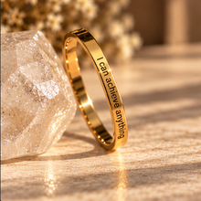 Load image into Gallery viewer, Gold 'I can achieve anything' ring standing beside a clear crystal - Let's Jam, Camden Town London
