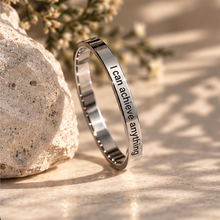 Load image into Gallery viewer, Silver 'I can achieve anything' affirmation ring resting against a stone - Let's Jam jewellery, Camden Market
