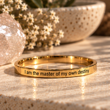Load image into Gallery viewer, Gold 'I am the master of my own destiny' ring on a beige stone surface - Let's Jam, Camden Town London
