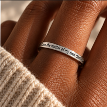 Load image into Gallery viewer, Hand wearing the silver 'I am the master of my own destiny' affirmation ring - Let's Jam jewellery, Camden Town
