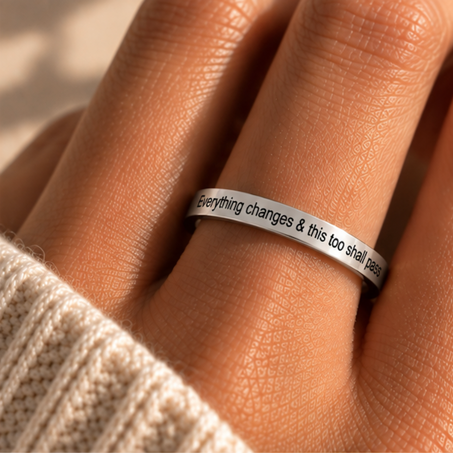 Hand wearing the silver 'Everything changes & this too shall pass' ring - Let's Jam jewellery, Camden Market