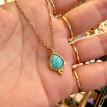 Load image into Gallery viewer, Faceted amazonite tear drop pendant in a gold setting held in the hand - Let's Jam, Camden Town London
