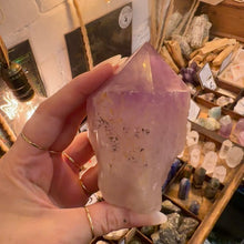 Load image into Gallery viewer, Close up of the smooth polished faces of the purple amethyst point - Let's Jam, Camden Market London
