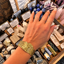 Load image into Gallery viewer, Wide ornate gold cuff bangle worn on the wrist - Let's Jam, Camden Market, London
