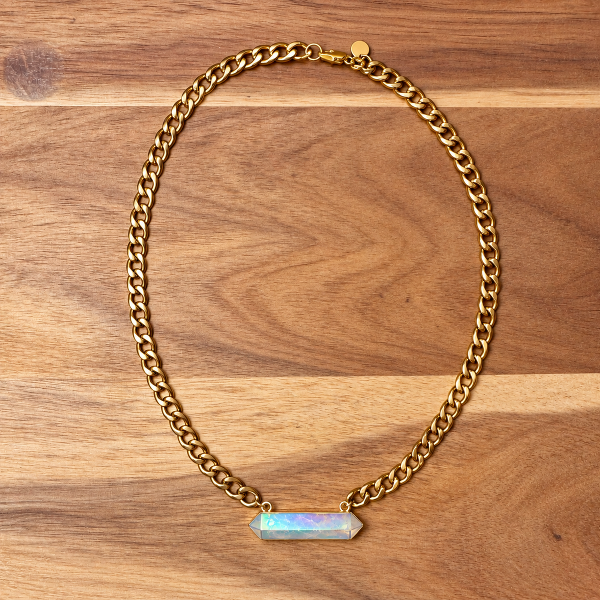 Gold Cuban chain necklace with a rainbow aura quartz point on wood - Let's Jam, Camden Town
