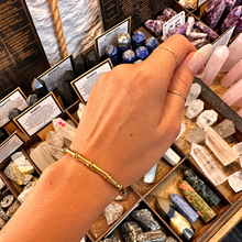 Load image into Gallery viewer, Slim gold bamboo bangle worn on the wrist - Let's Jam jewellery, Camden Town

