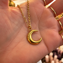 Load image into Gallery viewer, Gold big crescent moon pendant held in the hand - Let's Jam, Camden Town London
