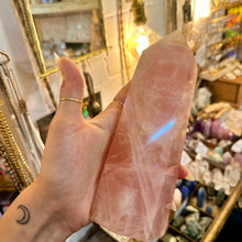 Load image into Gallery viewer, Close up of the polished surface of the rose quartz crystal point - Let's Jam, Camden Market London
