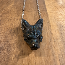 Load image into Gallery viewer, Hand carved black wolf head pendant on a silver chain on wood - Let's Jam, Camden Market, London
