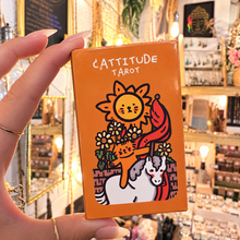 Load image into Gallery viewer, Cattitude Tarot box with its cats and sunflowers, held in the hand - Let's Jam, Camden Market
