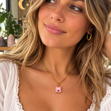 Load image into Gallery viewer, Pink hand painted daisy ceramic necklace worn with a white top - Let's Jam, Camden Town
