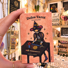 Load image into Gallery viewer, Back of the Delos Tarot box showing a witch at her table - Let's Jam, Camden Town
