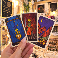 Load image into Gallery viewer, Three colourful Delos Tarot cards held in the hand - Let's Jam, Camden Market London
