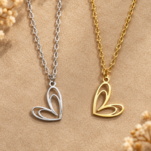 Load image into Gallery viewer, Gold and silver open double heart pendants side by side - Let's Jam, Camden Town London
