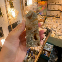 Load image into Gallery viewer, Druzy agate tower number two held up to the light - Let's Jam, Camden Market, London
