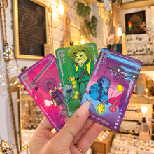 Load image into Gallery viewer, Four fluorescent Eldritch Overload cards fanned out in the hand - Let's Jam, Camden Market London
