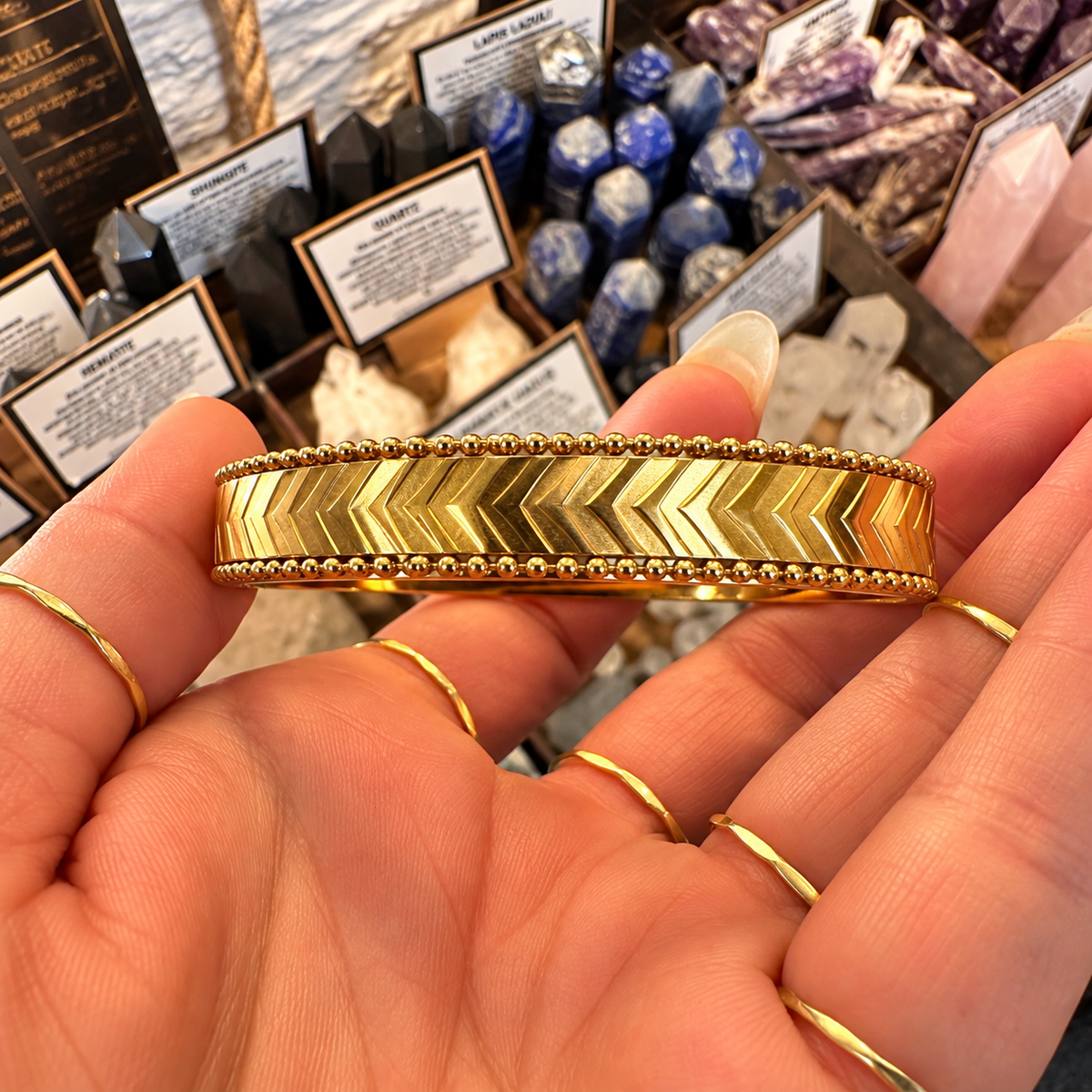 Front of the gold bangle showing its arrow pattern - Let's Jam, Camden Town